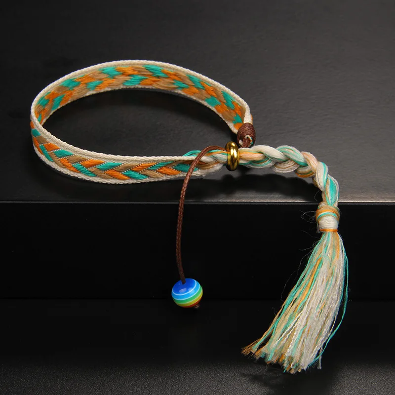 Damvästerländskt handgjort flätat armband med tofs - Bild 9